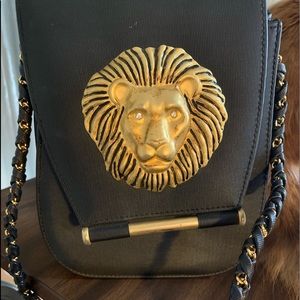 Nima Black purse /lion head and rhinestone eyes.